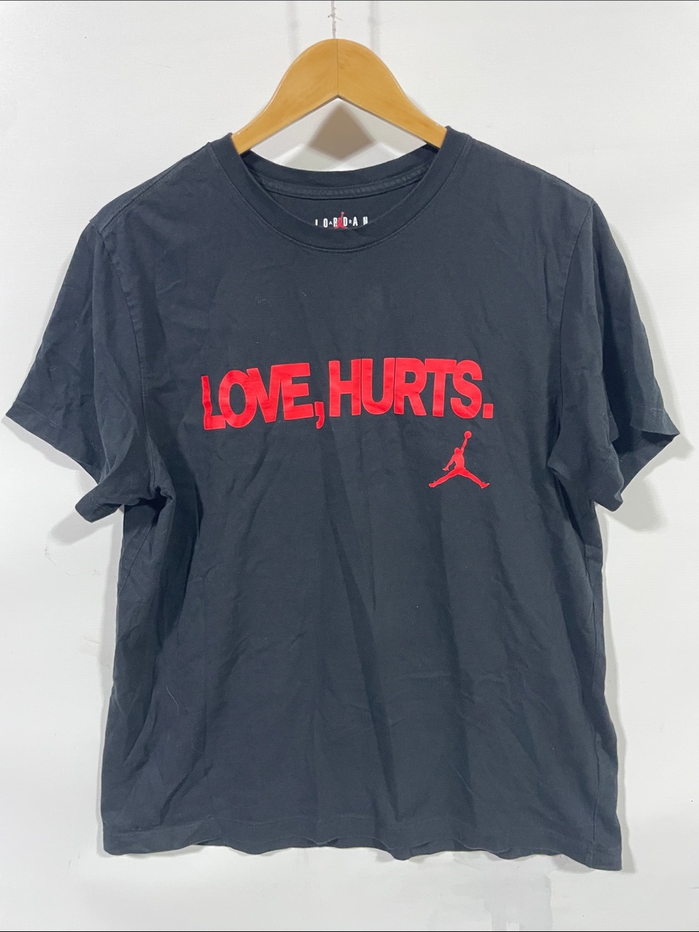 Jordan Black Short-Sleeve Tee with Red "LOVE, HURTS." Graphic